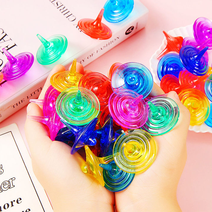 Buy 12 Pcs Transparent Plastic Spinning Top Toys in Bangladesh